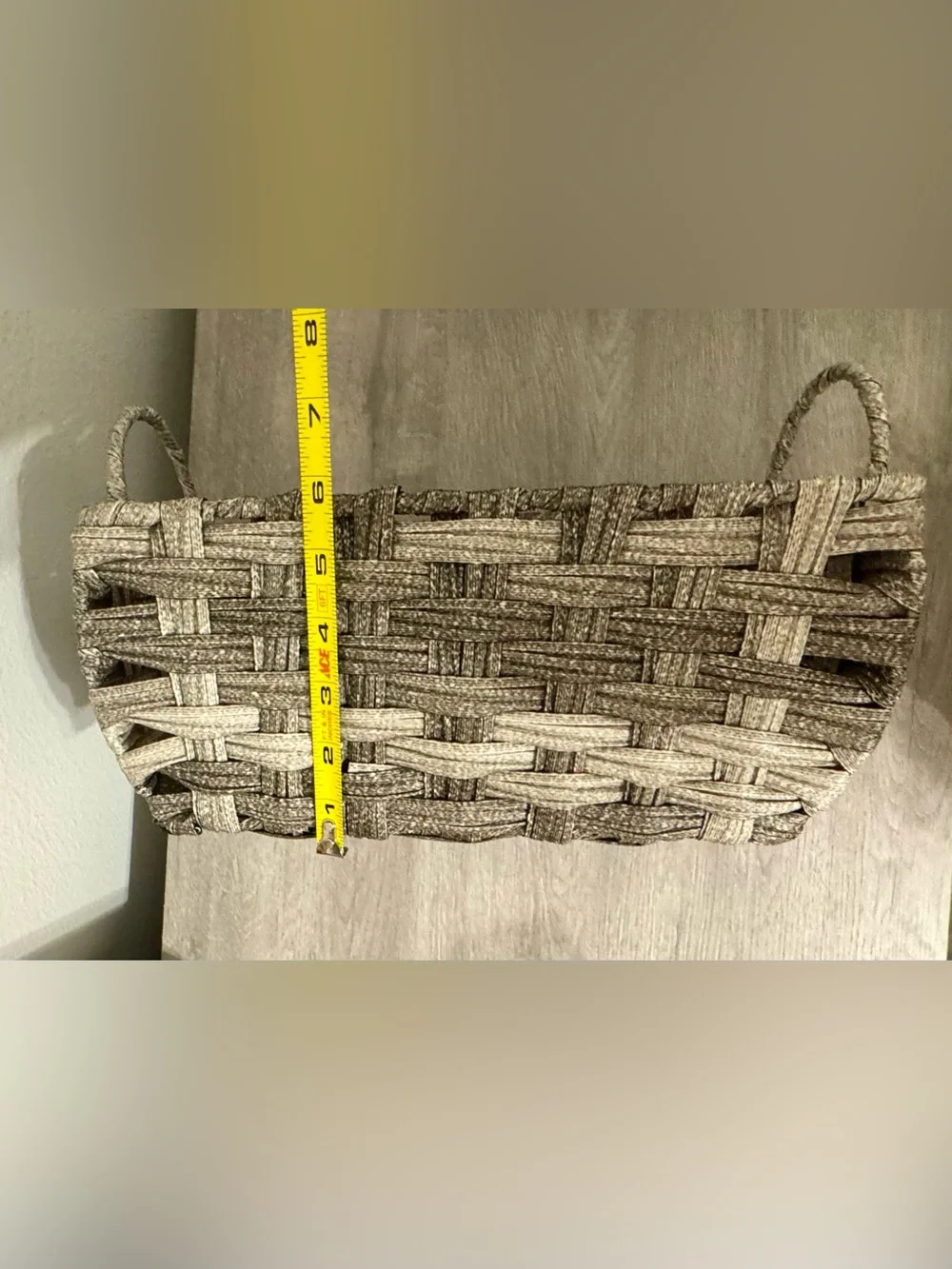 Allen +Roth . This small, grey decorative basket by allen + roth is made of poly
